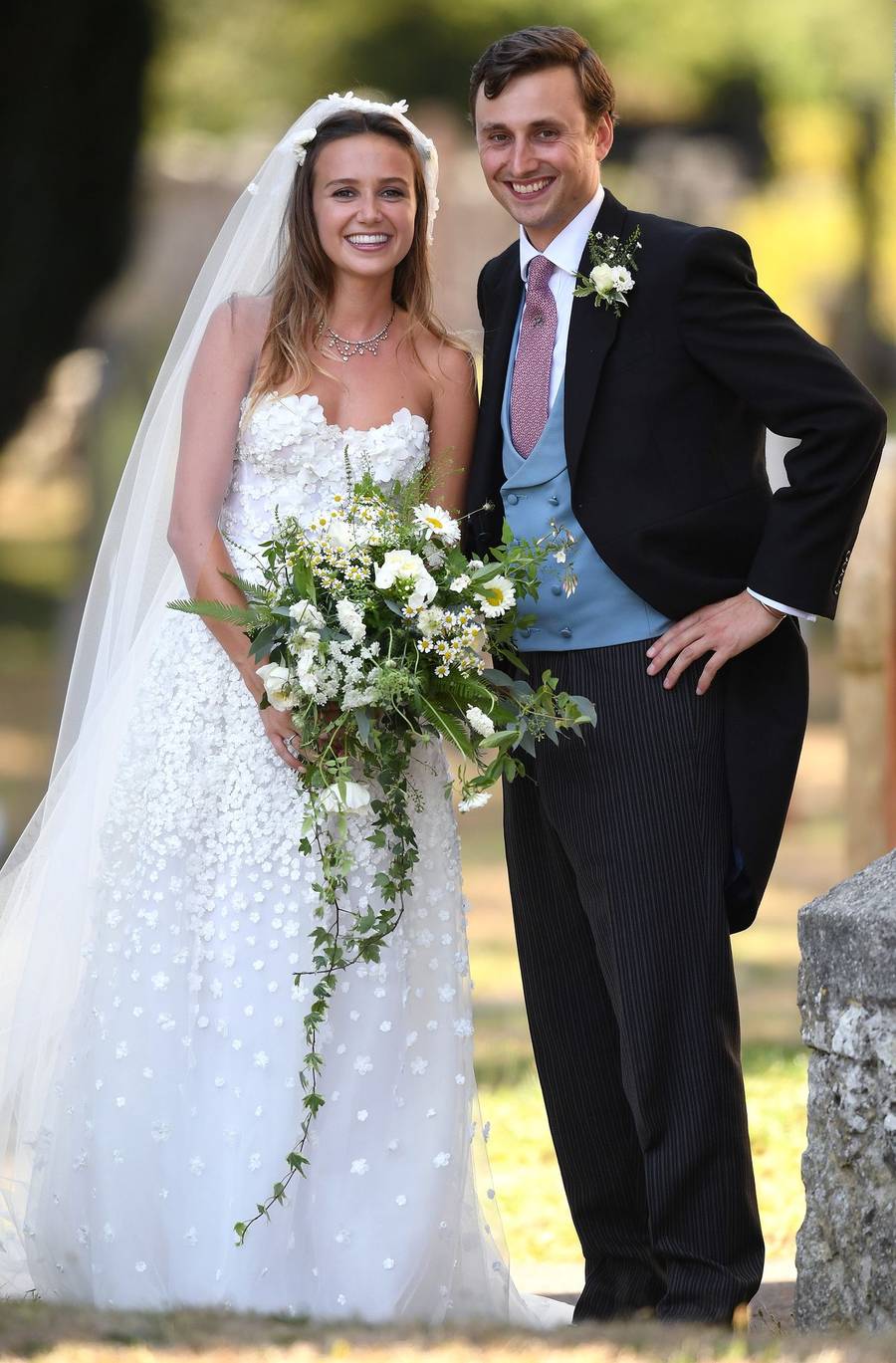 Księżna Meghan z księciem Harrym na ślubie Charliego van Straubenzee i Daisy Jenks