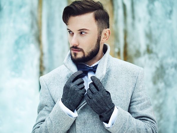 Outdoor portrait of handsome man in gray coat. Fashion photo. Beauty winter style