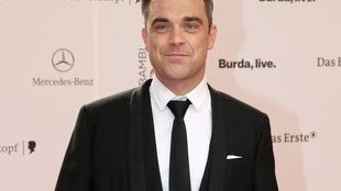 Robbie Williams zrobił tę głupią minę, ponieważ… [VIDEO]