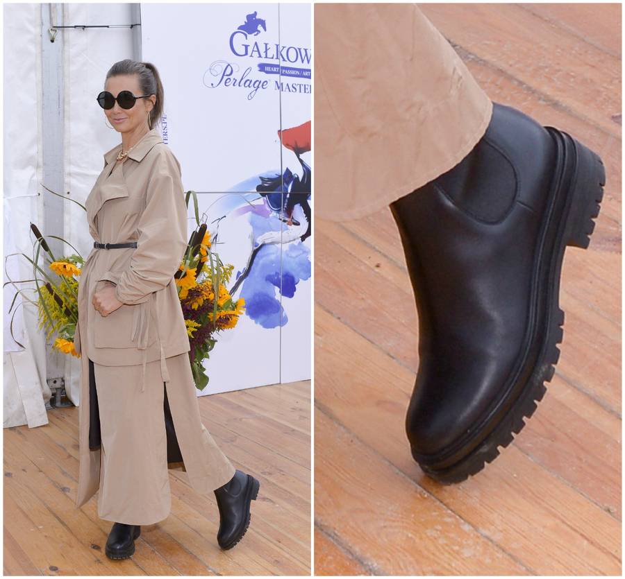 Kinga Rusin w długim, beżowym płaszczu i masywnych butach.