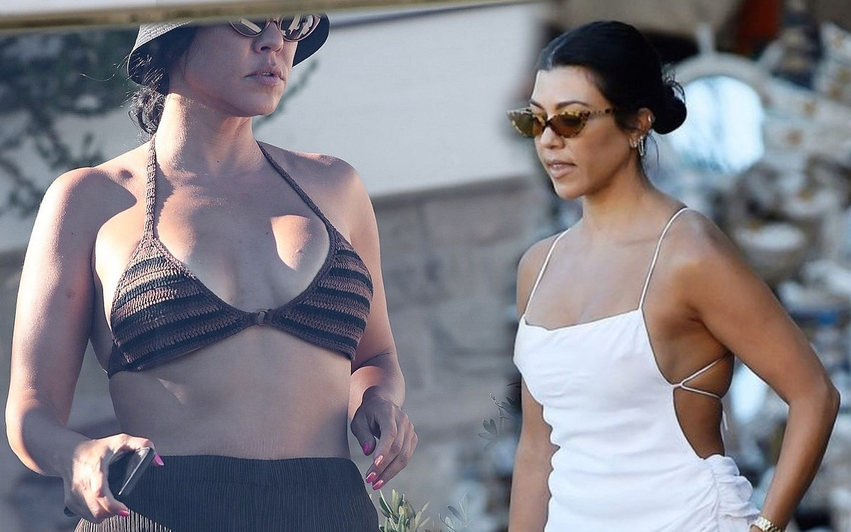 Uśmiechnięta Kourtney Kardashian uczy się surfowania. Co z jej ciążą? (FOTO)