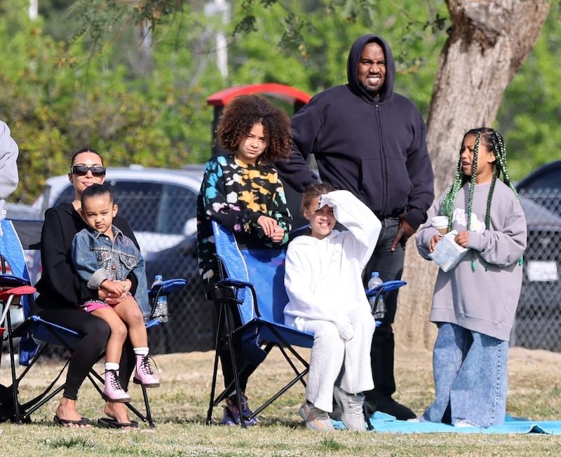 PREMIUM EXCLUSIVE: *MINIMUM FEE TO BE AGREED* Kim Kardashian and ex-husband Kanye West play friendly exes as they team up to watch their son Saint's soccer game in LA. Kanye arrived in his signature rubber boots and the rapper/fashion mogul was overrun by excitement as he brought out his phone to record Saint's game. We catch Saint stopping mid-game to run up to Kim and the two exchanged a big hug that lifted Saint off his feet. Kim and Kanye's daughter, North West, is also in attendance and she watches her brother's match standing next to dad, Ye. 27 Mar 2022,Image: 673612580, License: Rights-managed, Restrictions: World Rights, Model Release: no, Pictured: Kim Kardashian, Kanye West, North West, Credit line: Backgrid/P&P/MEGA / The Mega Agency / Forum