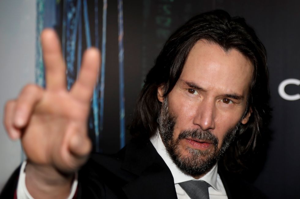 Actor Keanu Reeves gestures during the "Black Carpet" of the Canadian premiere of The Matrix Resurrections film in his former home town of Toronto, Ontario, Canada, December 16, 2021.,Image: 648358828, License: Rights-managed, Restrictions: , Model Release: no, Credit line: CARLOS OSORIO / Reuters / Forum