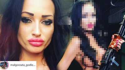 Ciemne ciało, blada twarz, pierś na wierzchu. Godlewska grozi karabinem!